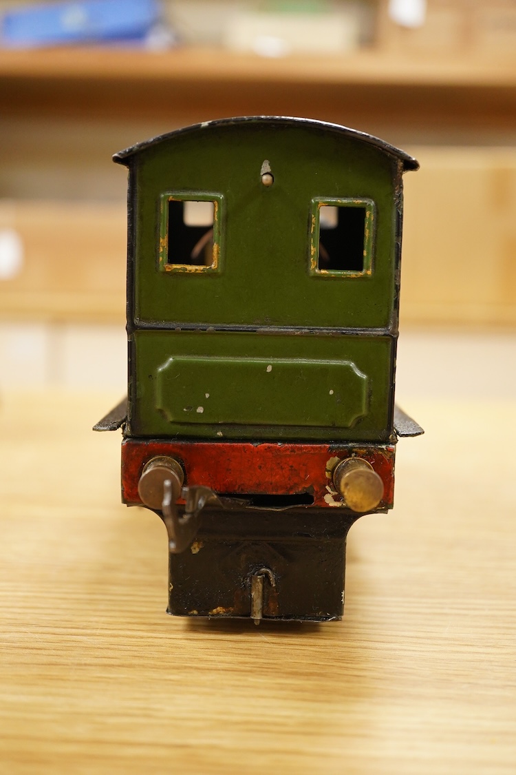 An early 20th century Gauge One Bing live steam 0-4-0T ‘I48’ locomotive, with a spirit fired pot boiler, driving a single oscillating vertical cylinder mounted in the cab, with twin outside dummy cylinders, the regulator